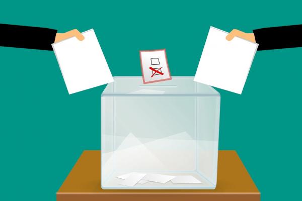 Image of ballot box with votes 